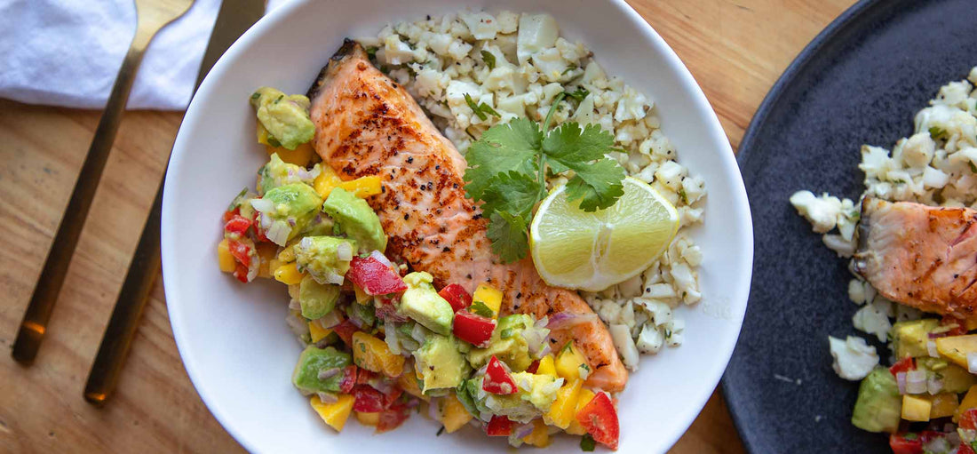 Salmon with Avo Mango Salsa Served with coriander & lime cauli rice